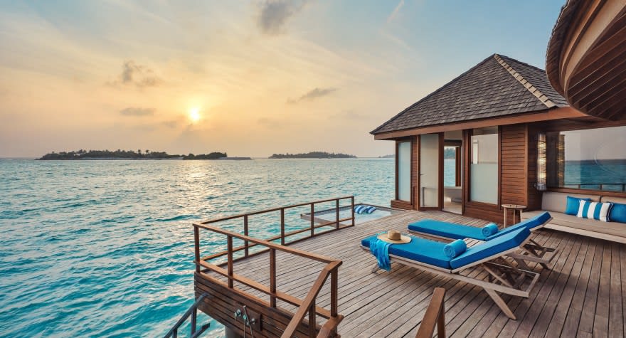 Sunrise Over Water Suite Deck with Loungers at Anantara Dhigu Maldives Resort