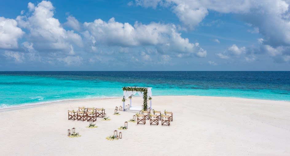 Beach wedding setup at Anantara Kihavah Maldives Villas