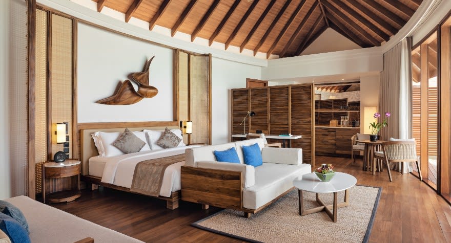 Sunset Over Water Pool Suite Bedroom at Anantara Dhigu Maldives Resort