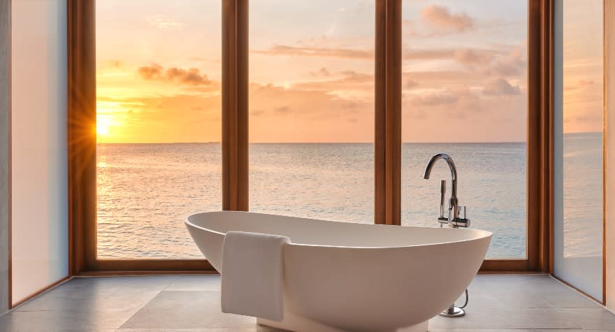 Sunset Over Water Pool Suite Bathtub at Anantara Dhigu Maldives Resort