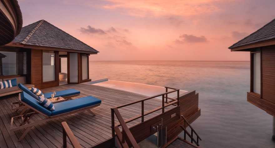 Sunset Over Water Pool Suite Deck with Loungers at Anantara Dhigu Maldives Resort