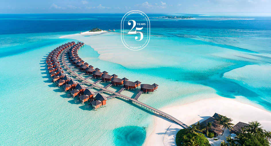 Aerial view of the overwater villas at Anantara Dhigu Maldives Resort