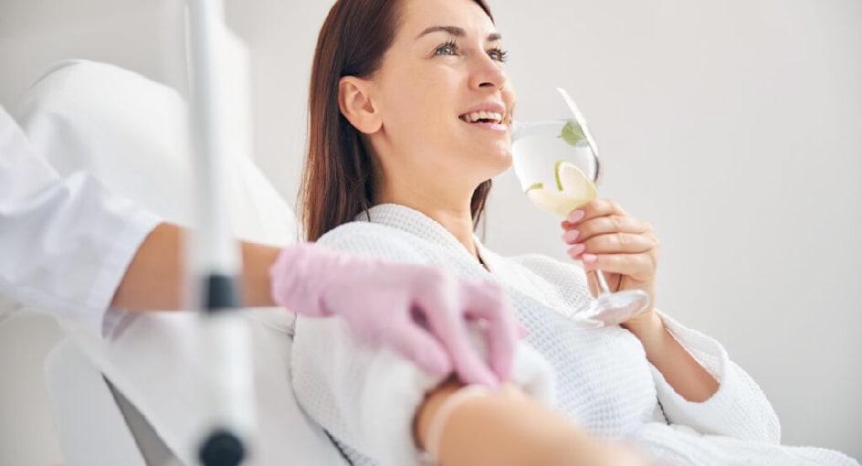Lady receiving IV therapy