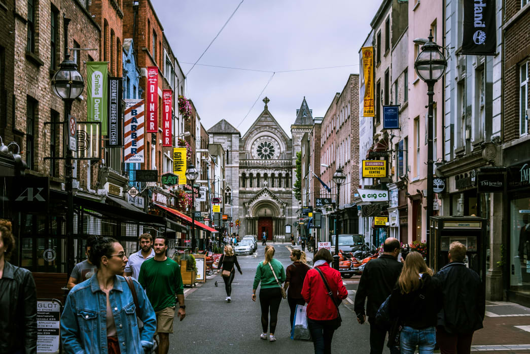 A Dublin city street with a small-sized crowd .