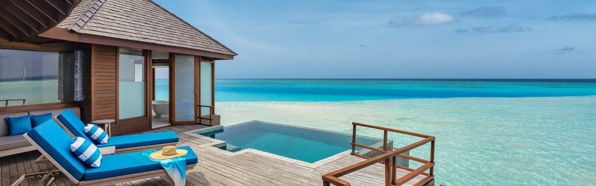 Over Water Pool Suite Villa Deck with Loungers at Anantara Dhigu Maldives Resort