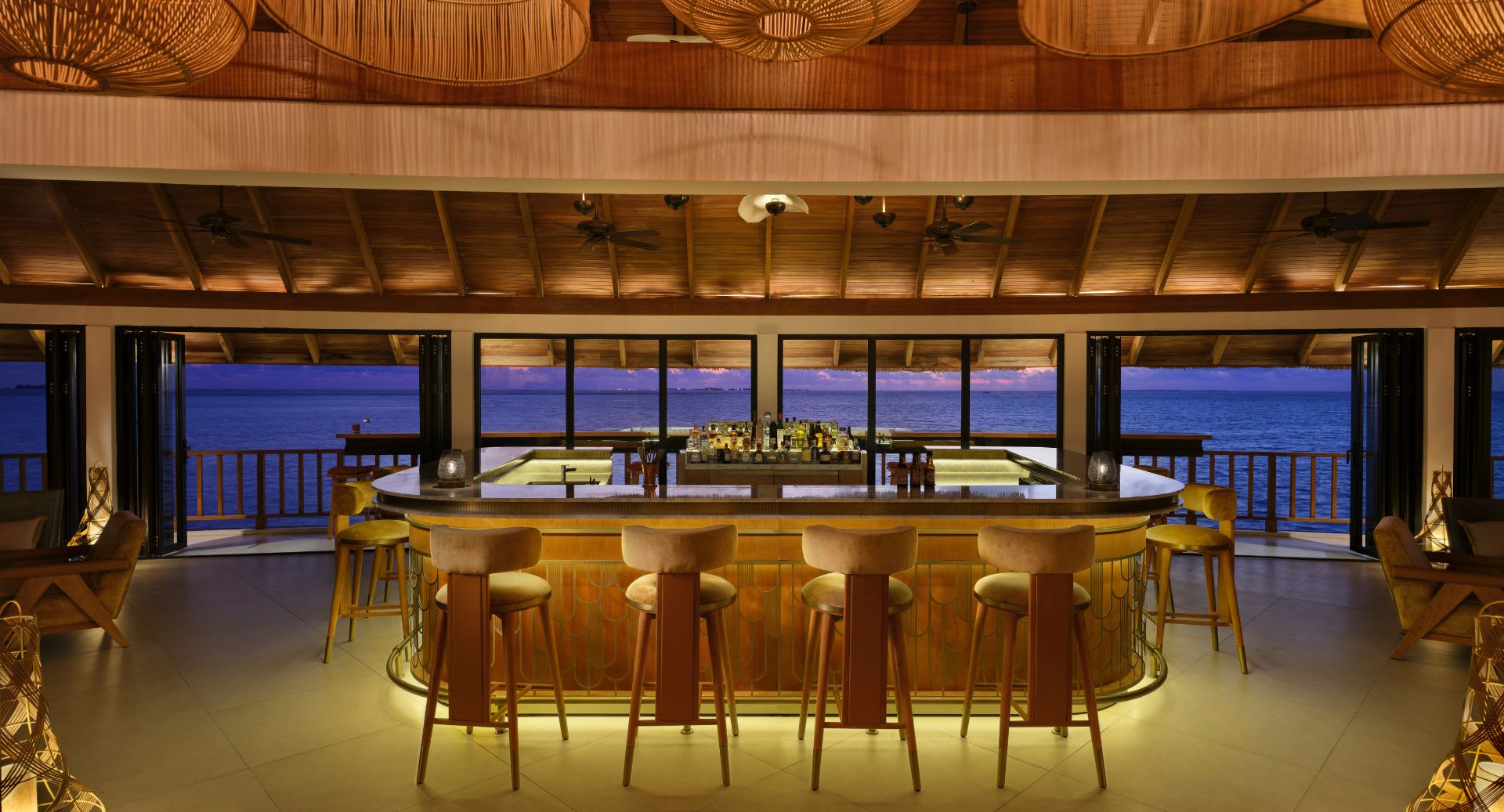 Interior bar view of The Yellow Fin Club at Anantara Dhigu Maldives Resort