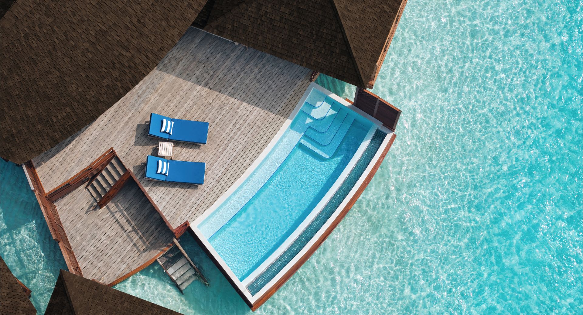 Aerial view of the villa and outdoor deck of the Deluxe Overwater Villa with Pool at Anantara Dhigu Maldives Resort