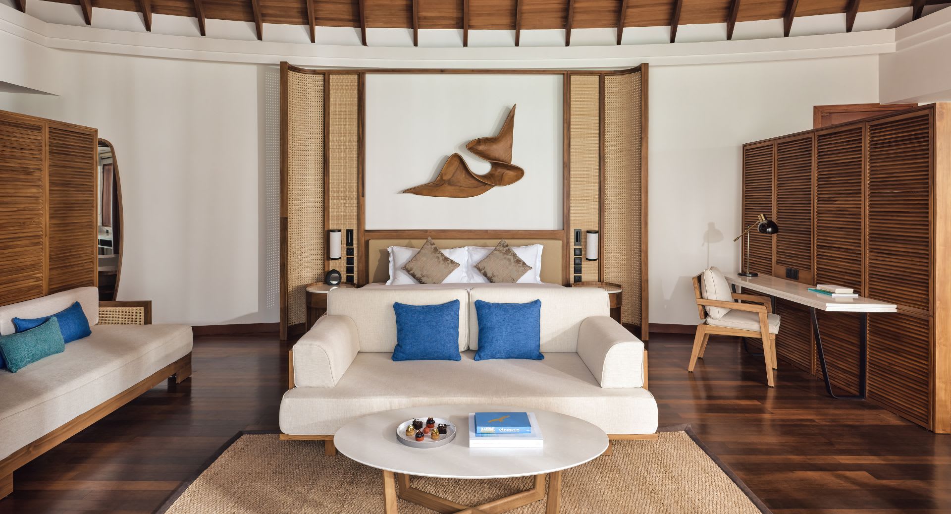 Interior view of the Overwater Villa Bedroom at Anantara Dhigu Maldives Resort
