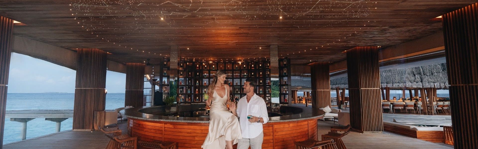 Couple at SKY restaurant at Anantara Kihavah Maldives