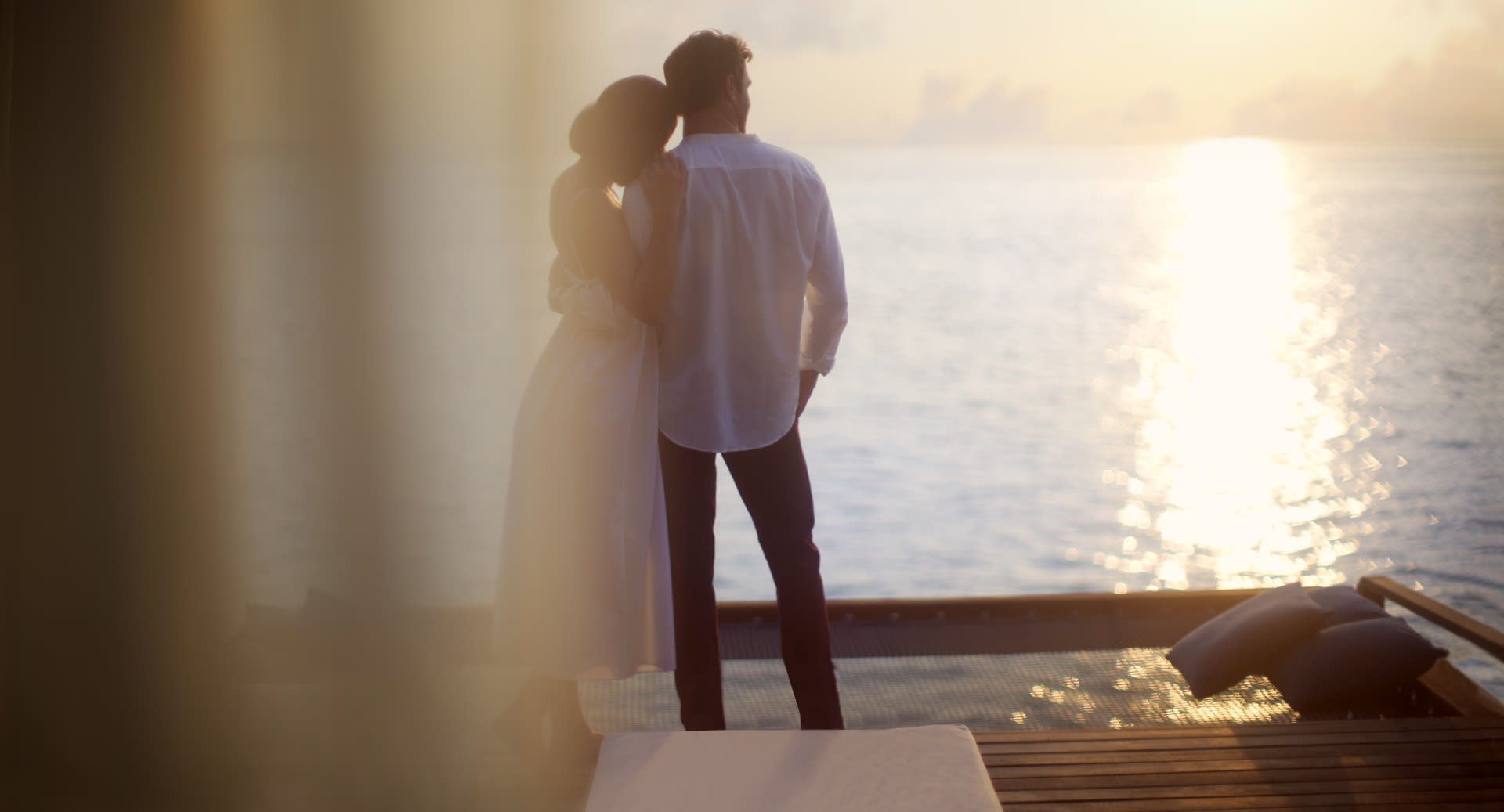 Couple at the ocean deck at Anantara Veli Maldives
