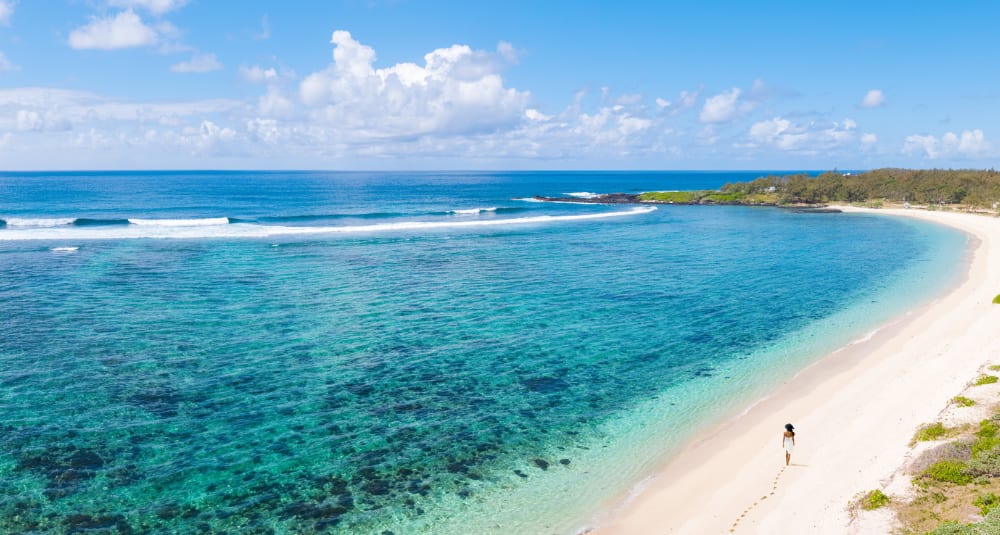 Sun-drenched sands of La Chaland Beach in Mauritius 