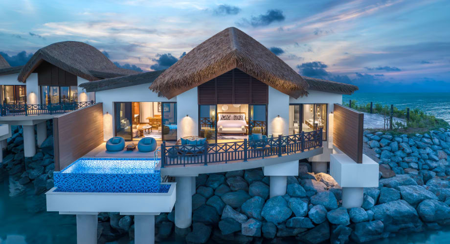 Luxury resort experience at Anantara Mina Ras Al Khaimah with over water villas. 