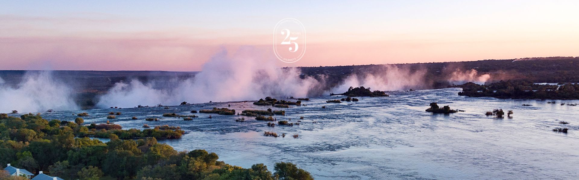 Aerial view of the Zambezi River and spray of the Victoria Falls from Royal Livingstone Hotel by Anantara