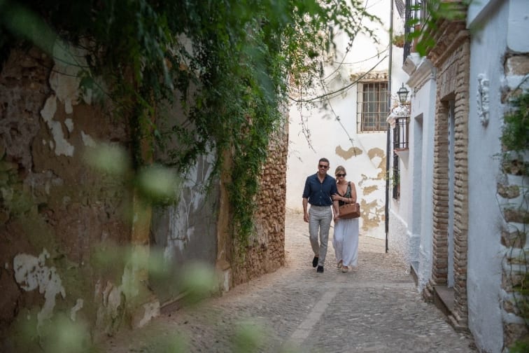 A couple walking in the streets of Marbella.