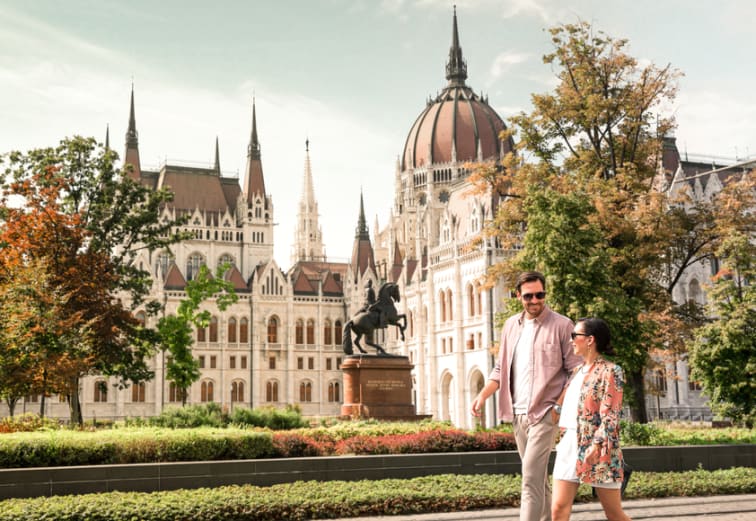 A couple walking on the streets of Budapest.