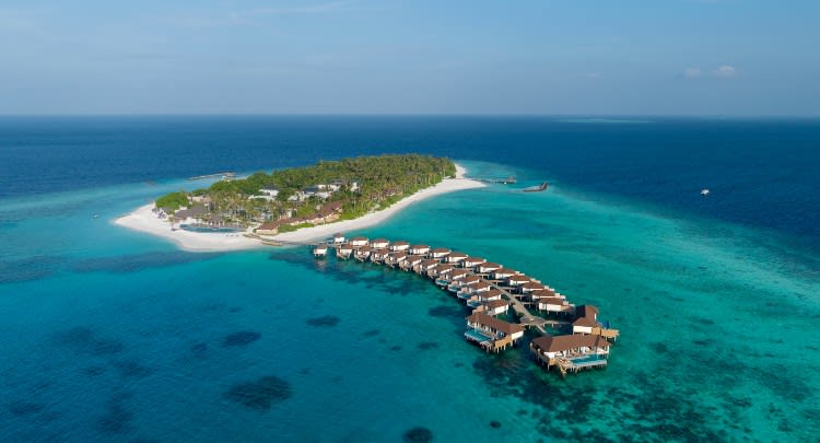 Aerial view of Avani+ Fares Maldives Resort with Over Water Pool Villas