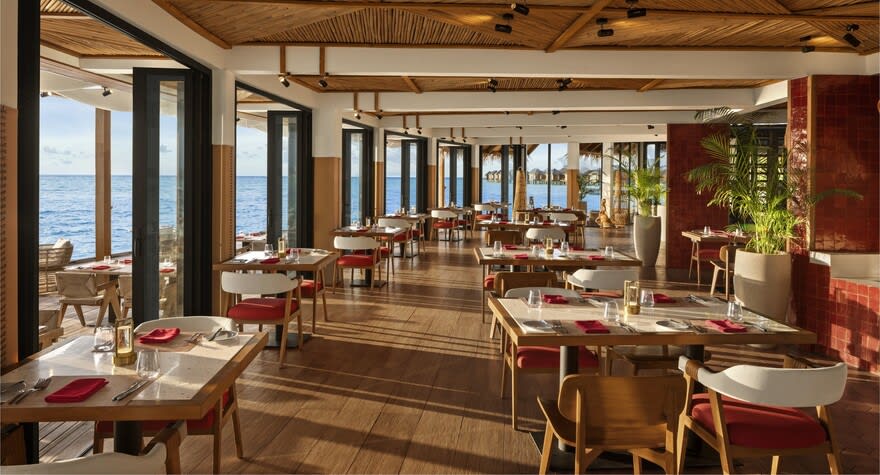Ocean-view dining setup at Sea Fire Salt, Anantara Dhigu Maldives.