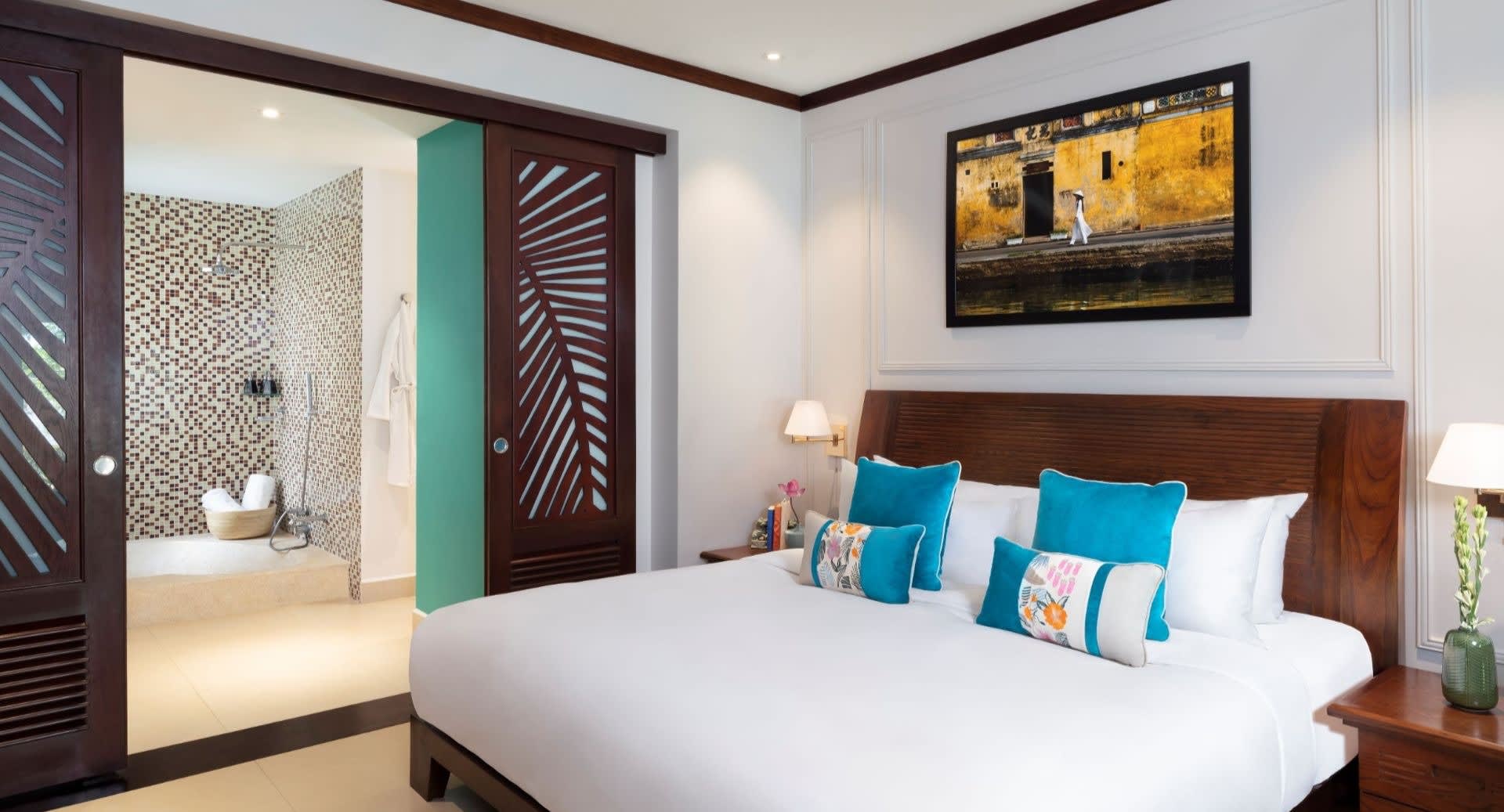 anantara_hoi_an_resort_guest_room_deluxe_river_view_suite_bedroom_on_the_upper_level_1920x1037.jpg