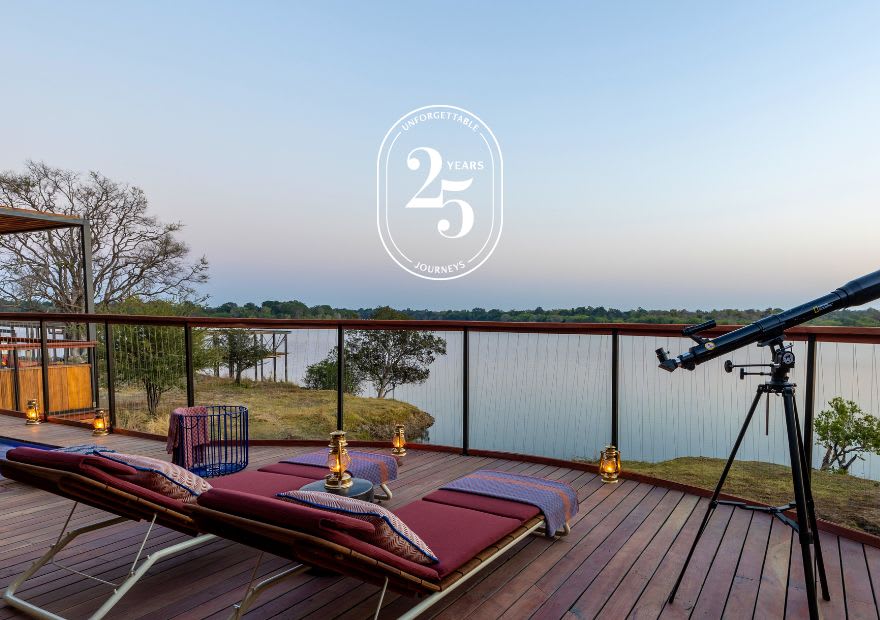 Deck with sunbeds, telescope and river view at Anantara Tented Camp Kafue River