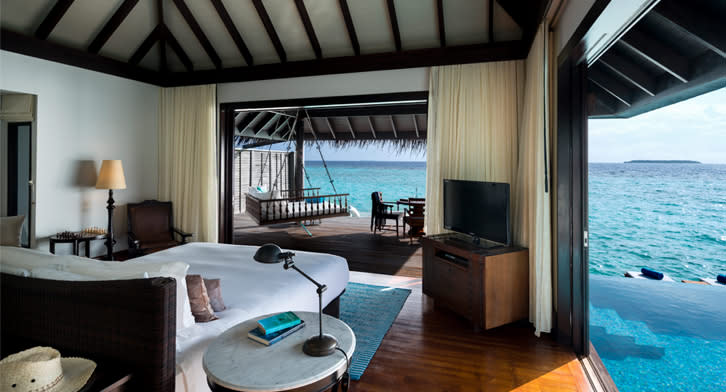 Kihavah Luxury Sunset Over Water Pool Villa Bedroom view
