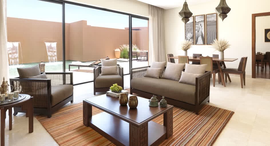 Living Spaces of Garden Pool Villas with Sofas in Nizwa Oman